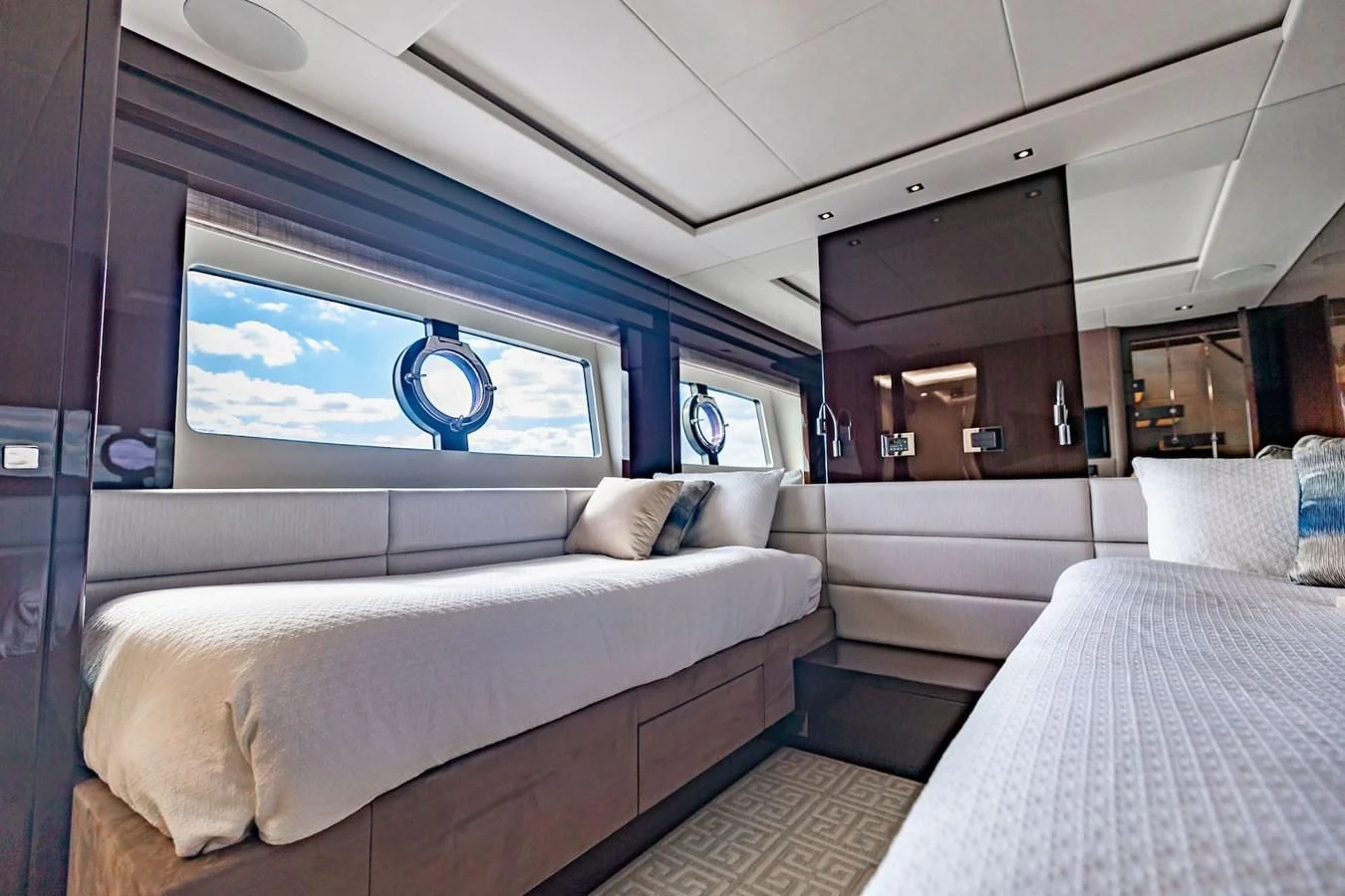 a room with a bed and a window aboard GOLDEN OURS Yacht for Sale