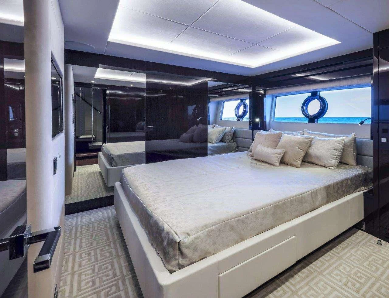 a room with a bed and a couch aboard GOLDEN OURS Yacht for Sale