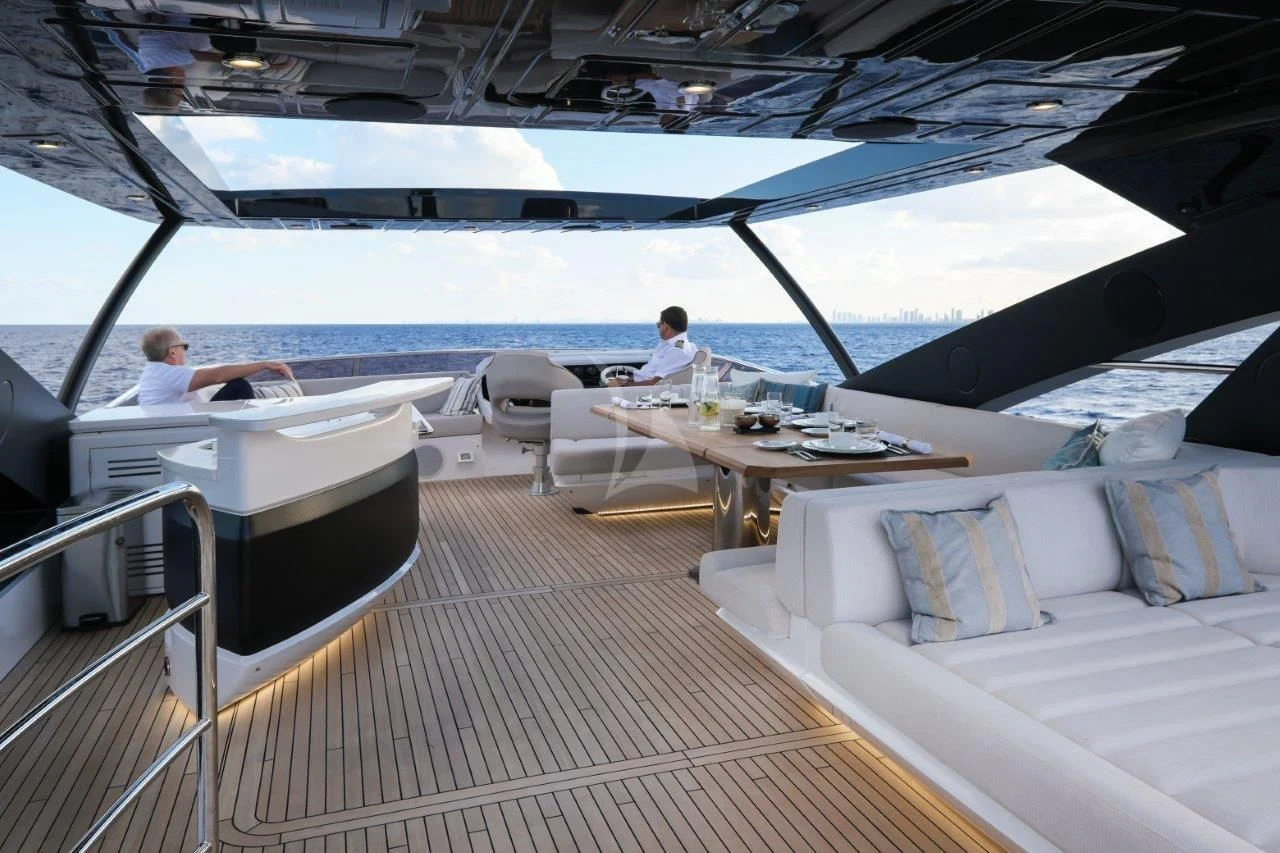 a boat with a couple of people on it aboard GOLDEN OURS Yacht for Sale