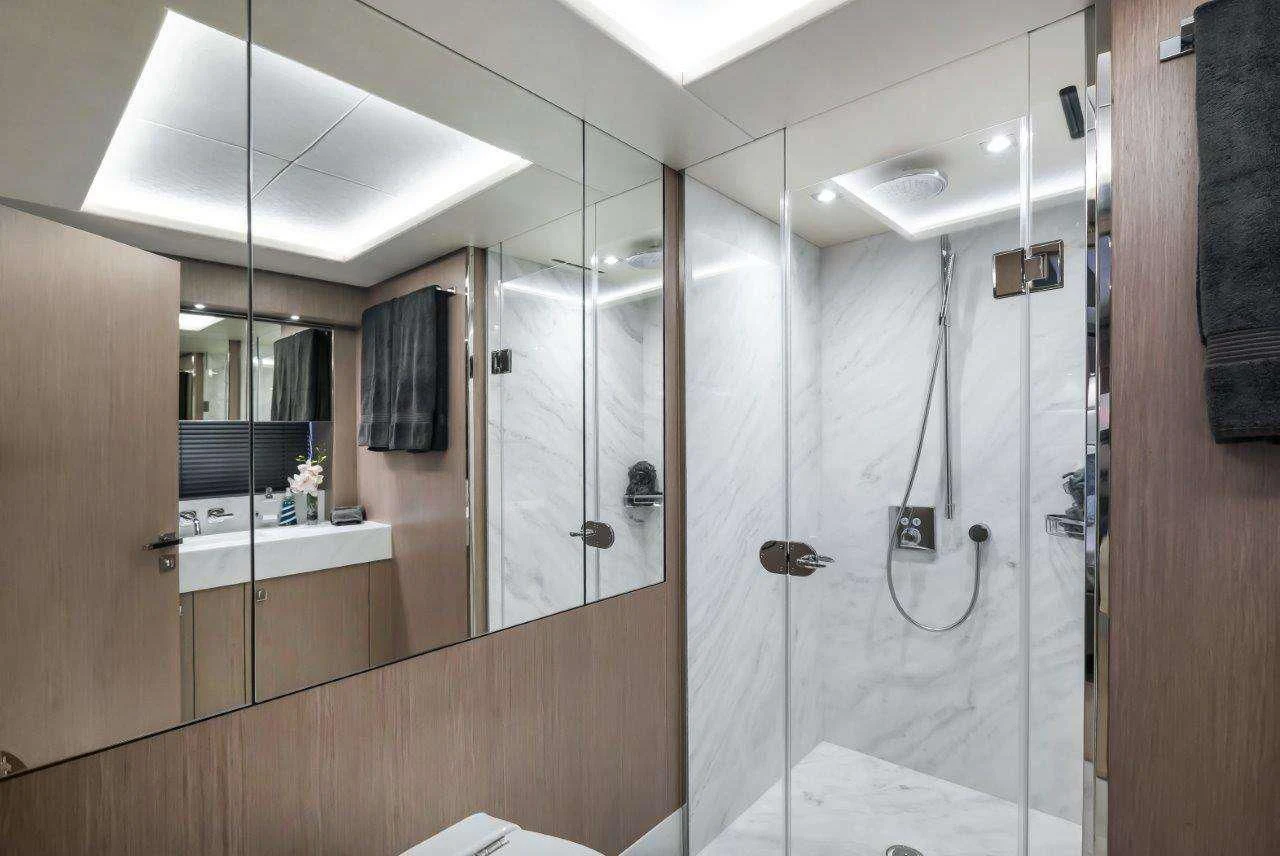 a bathroom with a shower unit aboard GOLDEN OURS Yacht for Sale