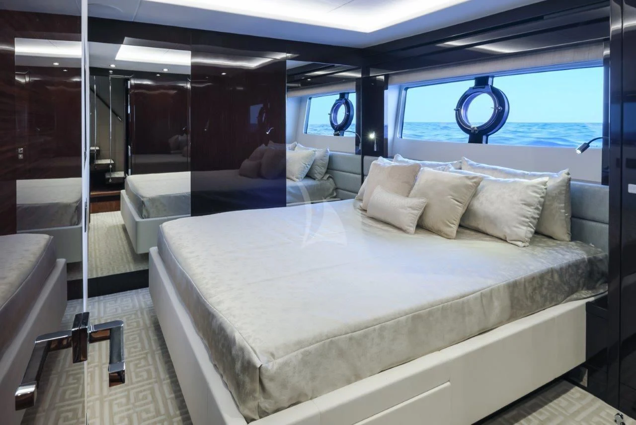 a room with a bed and a window aboard GOLDEN OURS Yacht for Sale