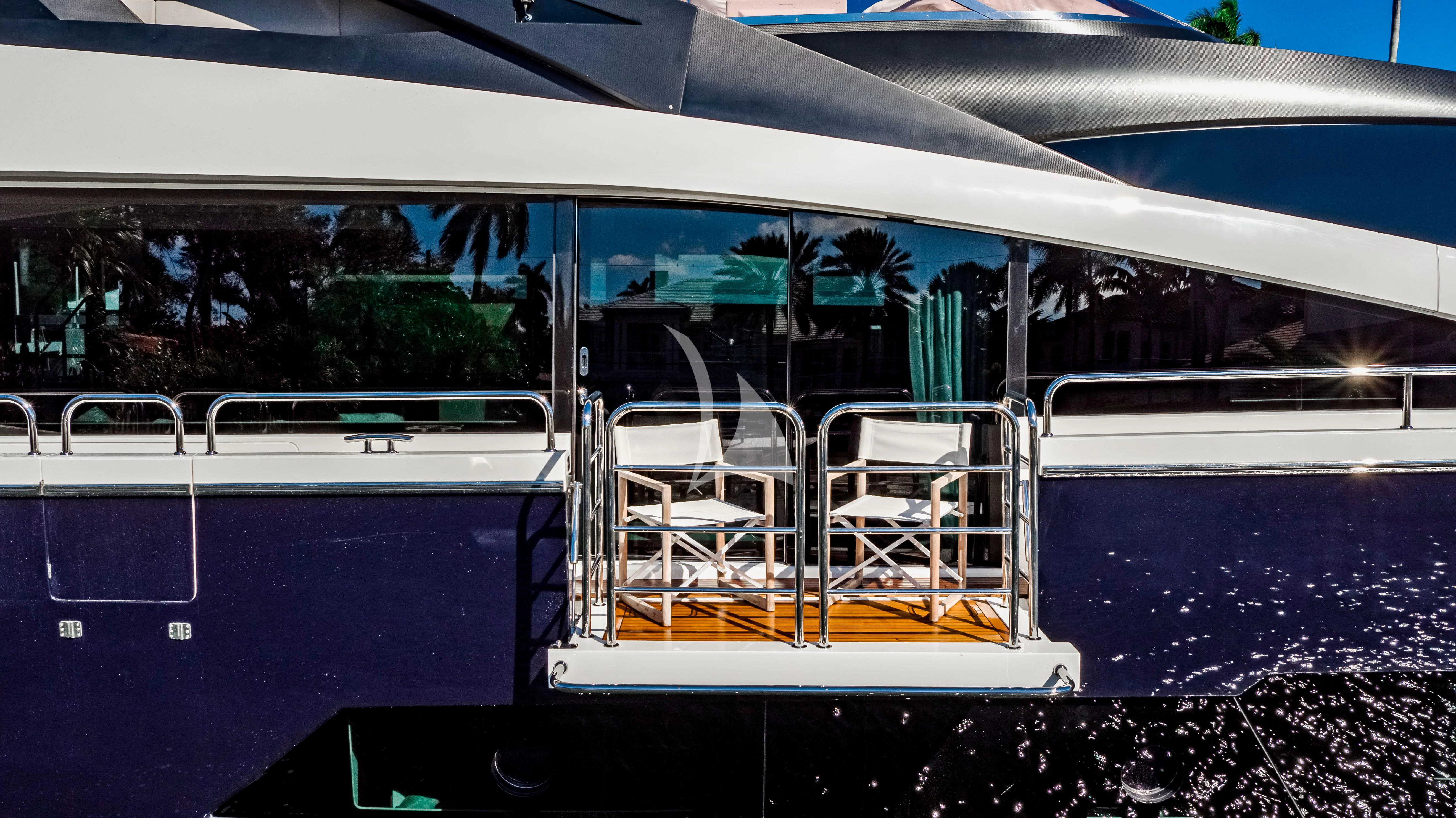 a boat with chairs on the deck aboard GOLDEN OURS Yacht for Sale