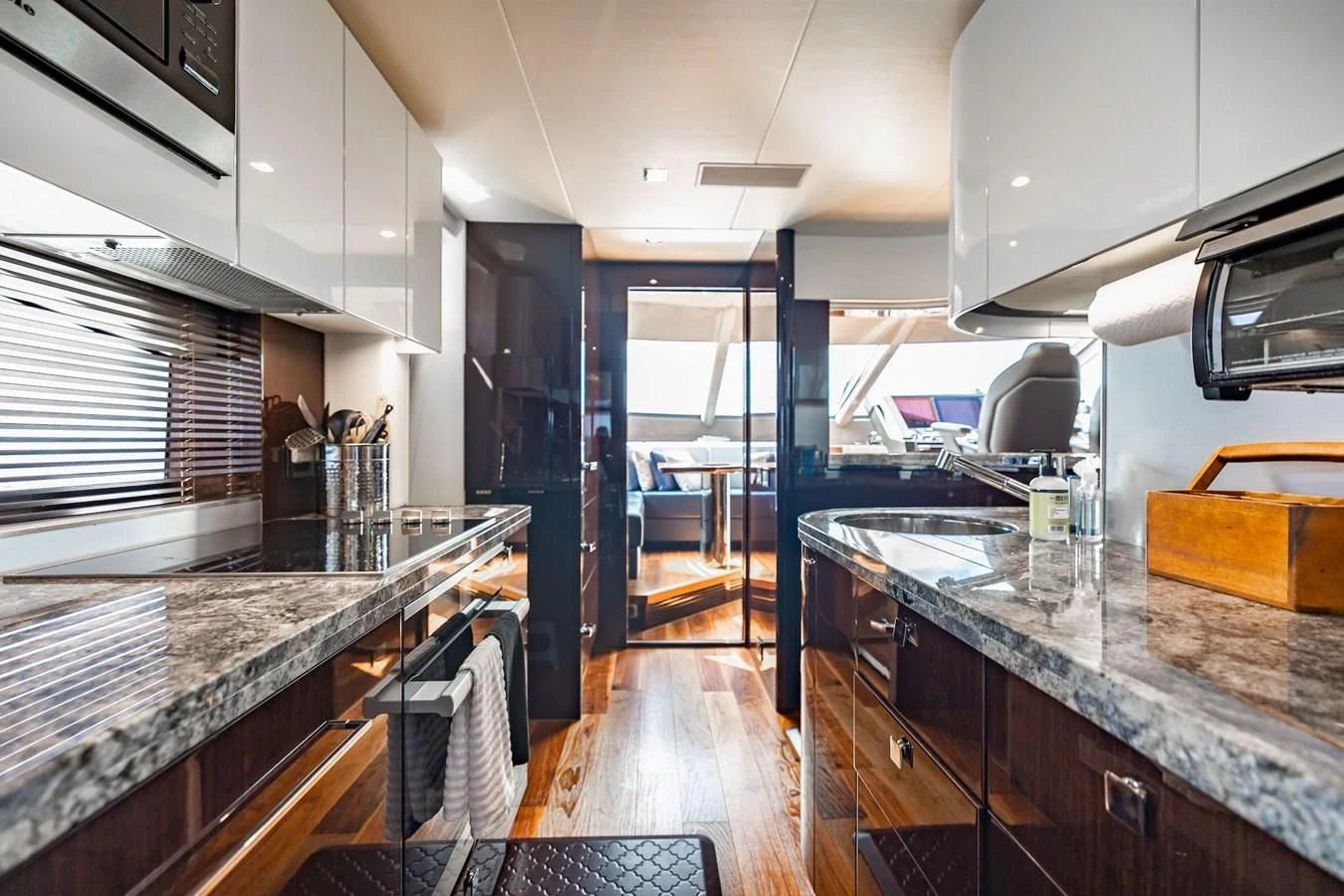 a kitchen with a large island aboard GOLDEN OURS Yacht for Sale