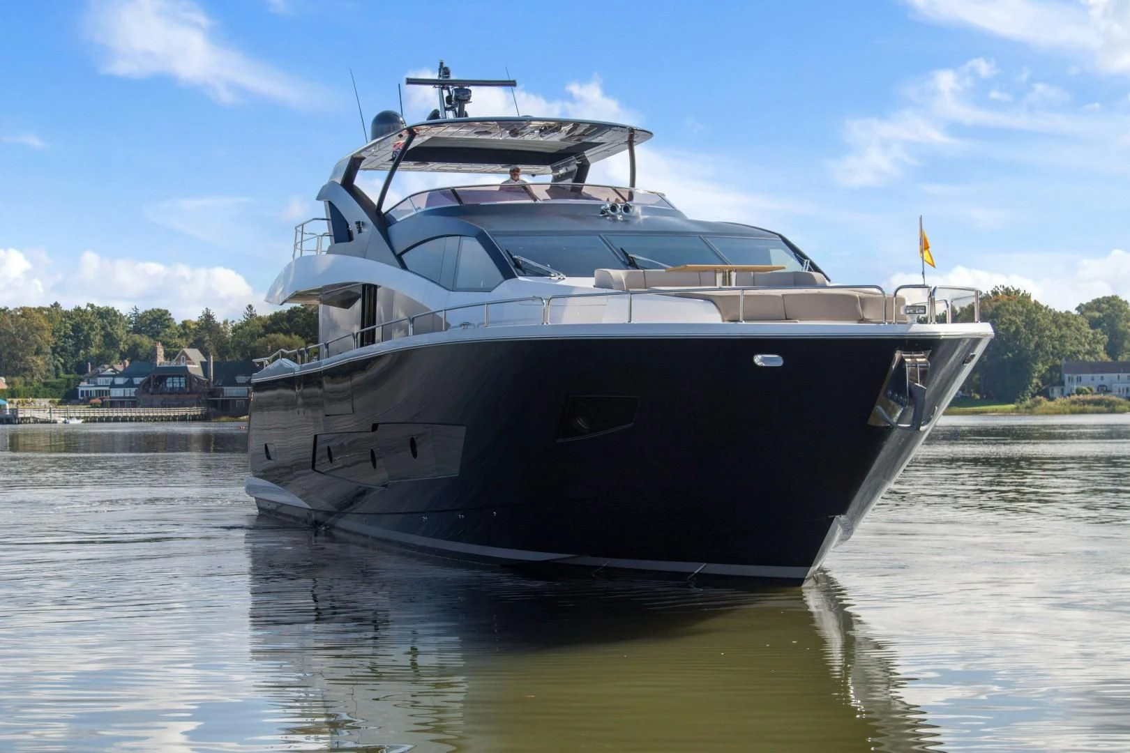 a large boat on the water aboard GOLDEN OURS Yacht for Sale