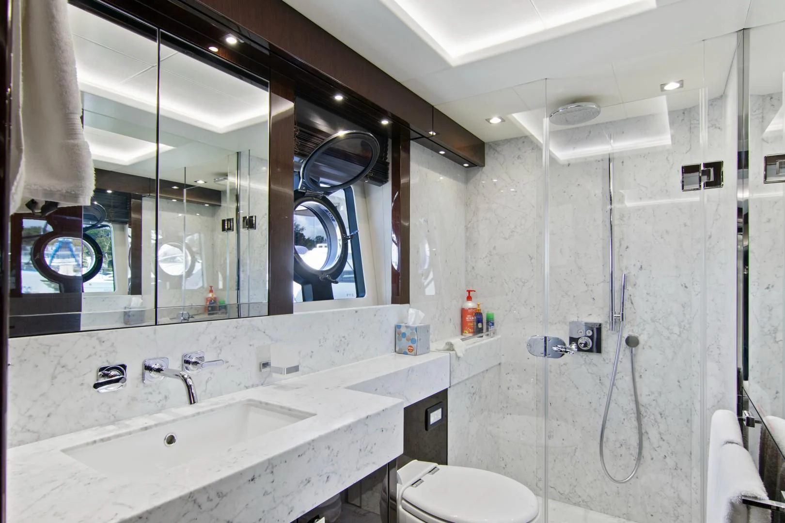 a bathroom with a large mirror aboard GOLDEN OURS Yacht for Sale
