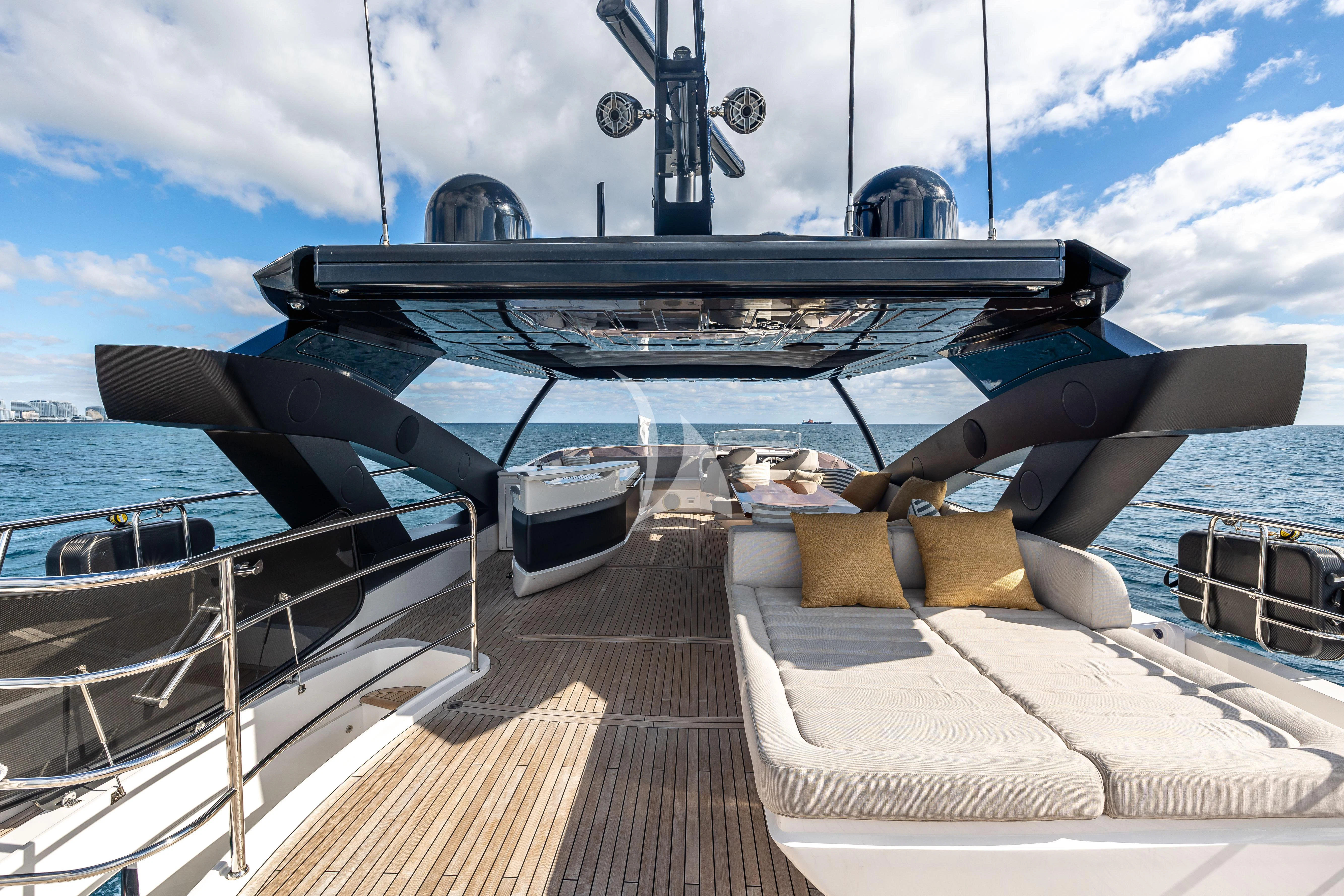 a person lying on a deck on a boat aboard GOLDEN OURS Yacht for Sale
