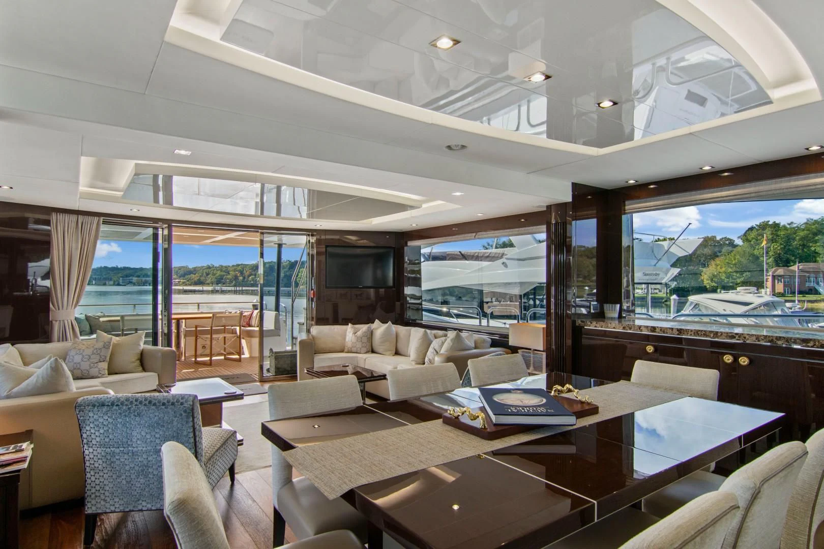 a living room with a large glass window aboard GOLDEN OURS Yacht for Sale