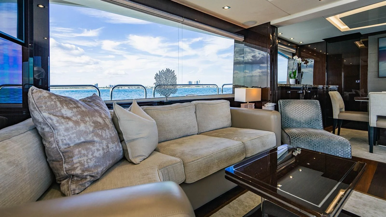 a living room with a large window aboard GOLDEN OURS Yacht for Sale