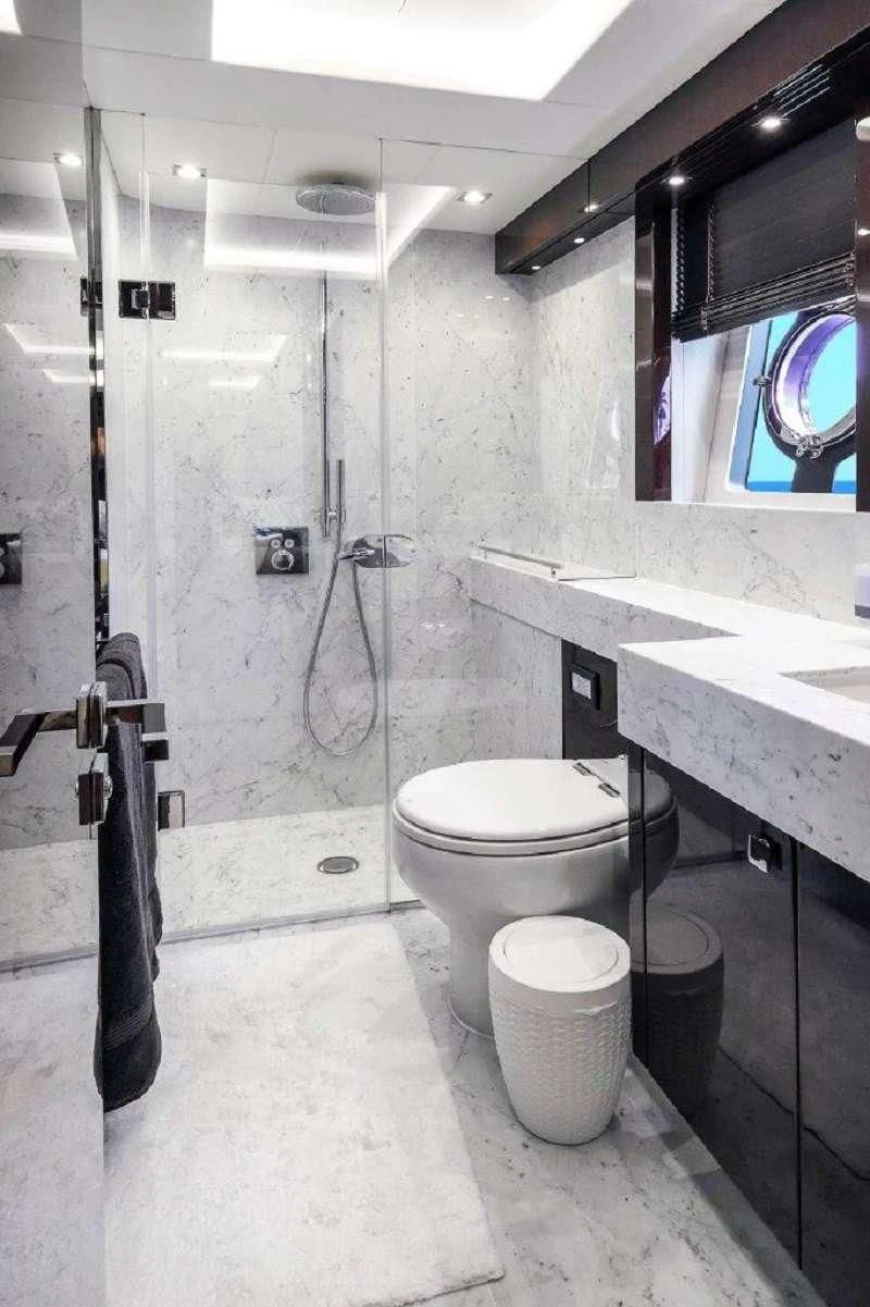 a bathroom with a toilet and sink aboard GOLDEN OURS Yacht for Sale