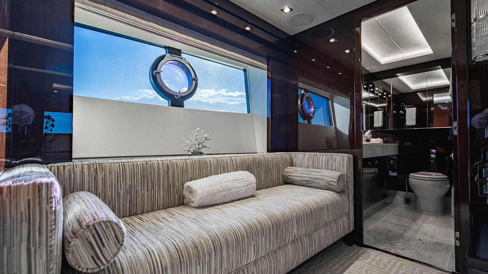 a room with a couch and a television aboard GOLDEN OURS Yacht for Sale
