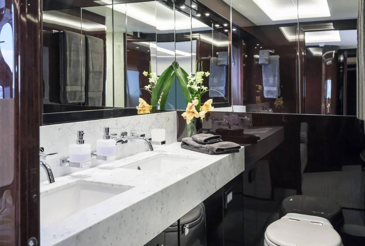 a bathroom with a sink and a mirror aboard GOLDEN OURS Yacht for Sale