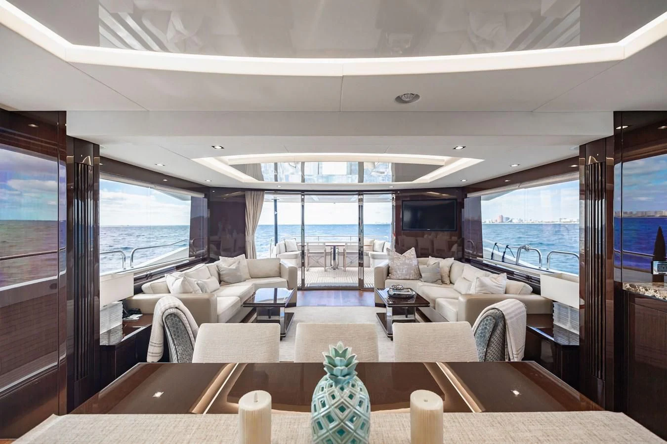 a living room with a large window aboard GOLDEN OURS Yacht for Sale
