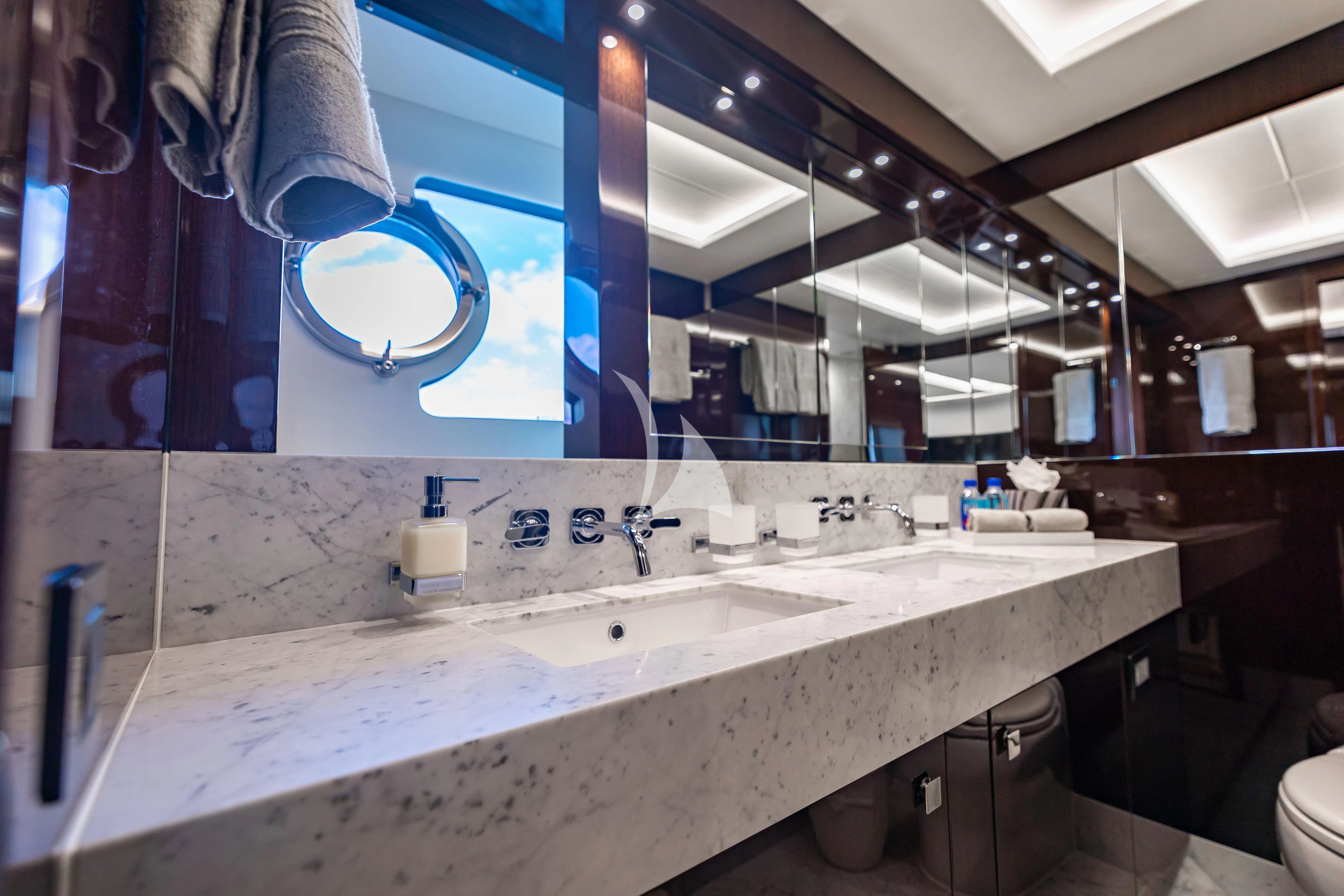 a bathroom with a large mirror aboard GOLDEN OURS Yacht for Sale