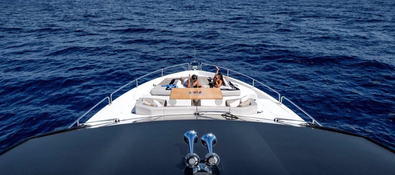 a white boat in the water aboard GOLDEN OURS Yacht for Sale