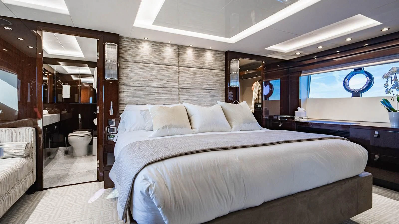 a room with a bed and a window aboard GOLDEN OURS Yacht for Sale