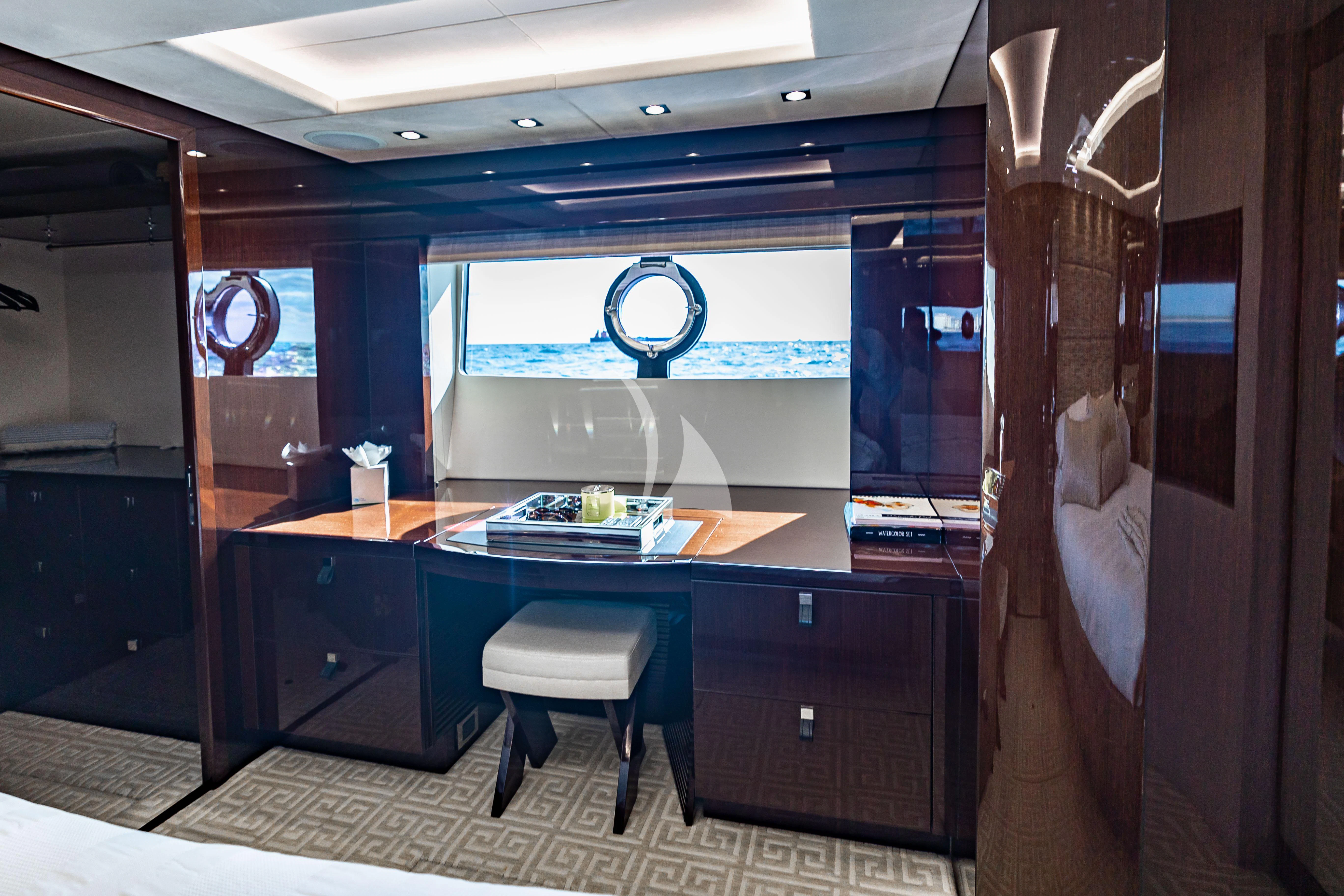 a room with a desk and chairs aboard GOLDEN OURS Yacht for Sale
