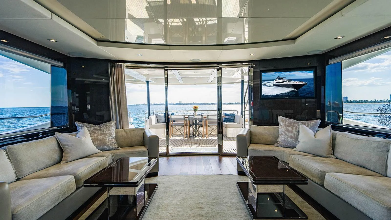 a living room with a large window aboard GOLDEN OURS Yacht for Sale