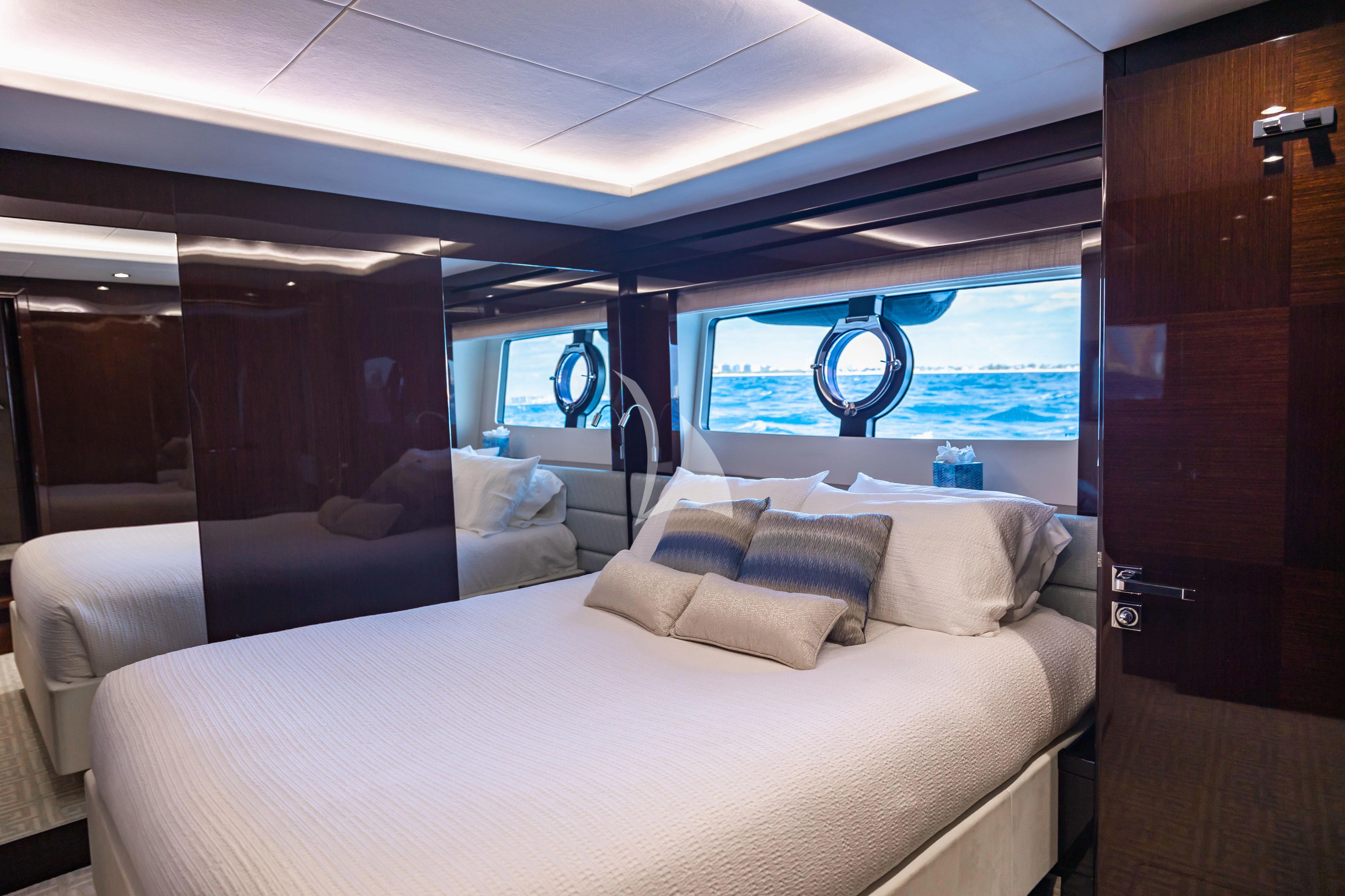 a room with a bed and a window aboard GOLDEN OURS Yacht for Sale