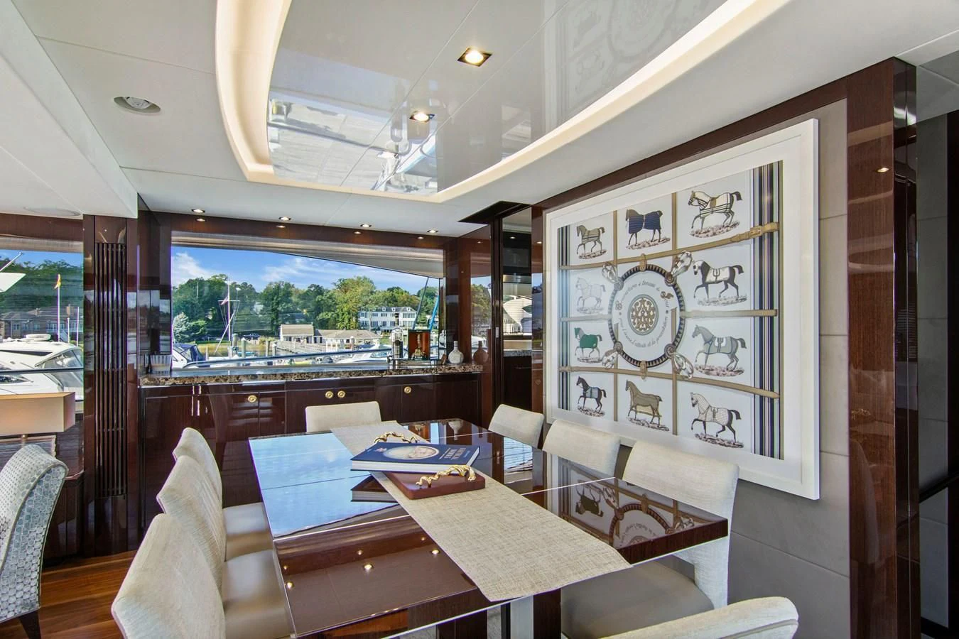 a dining room with a table and chairs aboard GOLDEN OURS Yacht for Sale