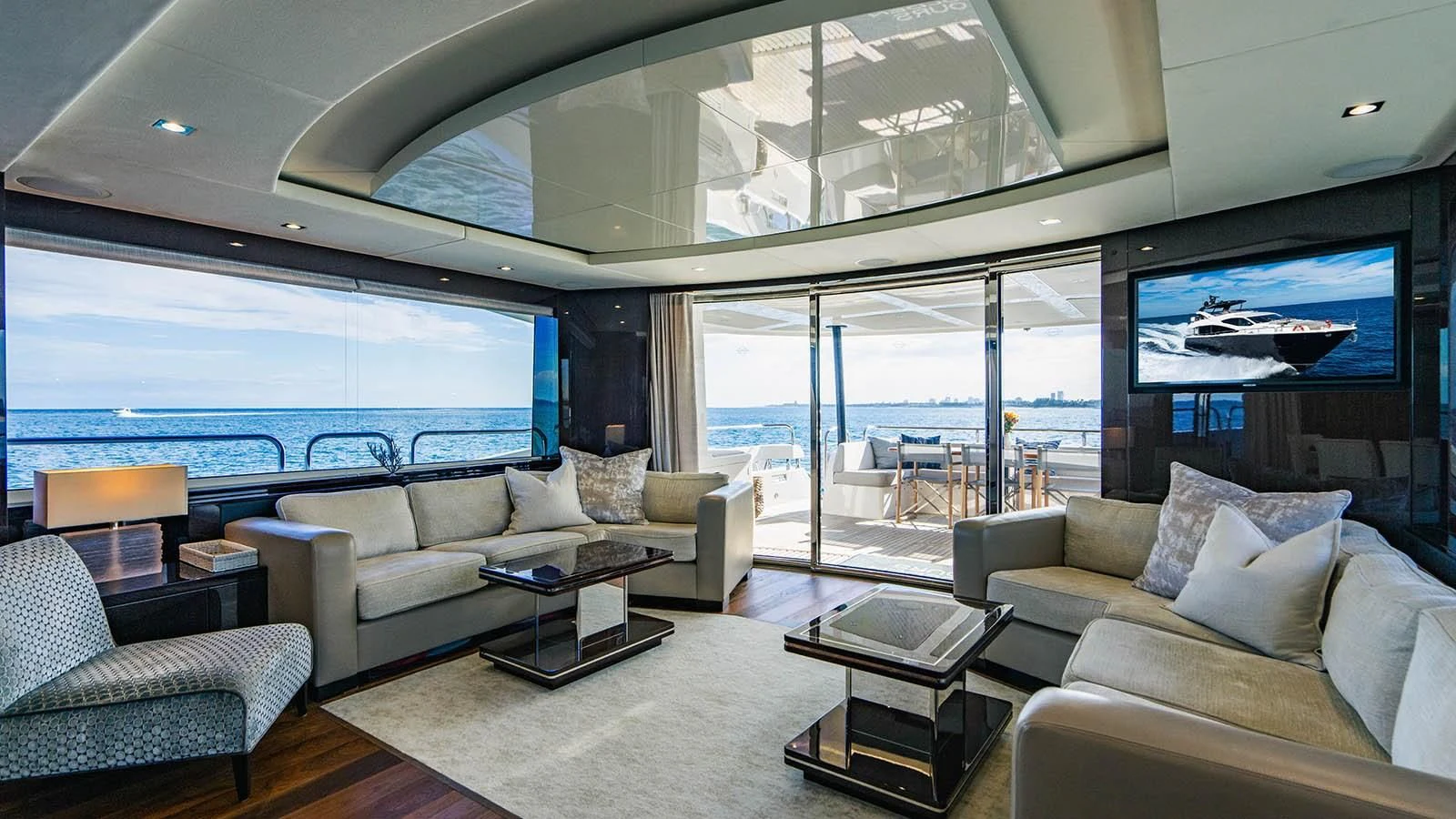 a living room with a large window aboard GOLDEN OURS Yacht for Sale