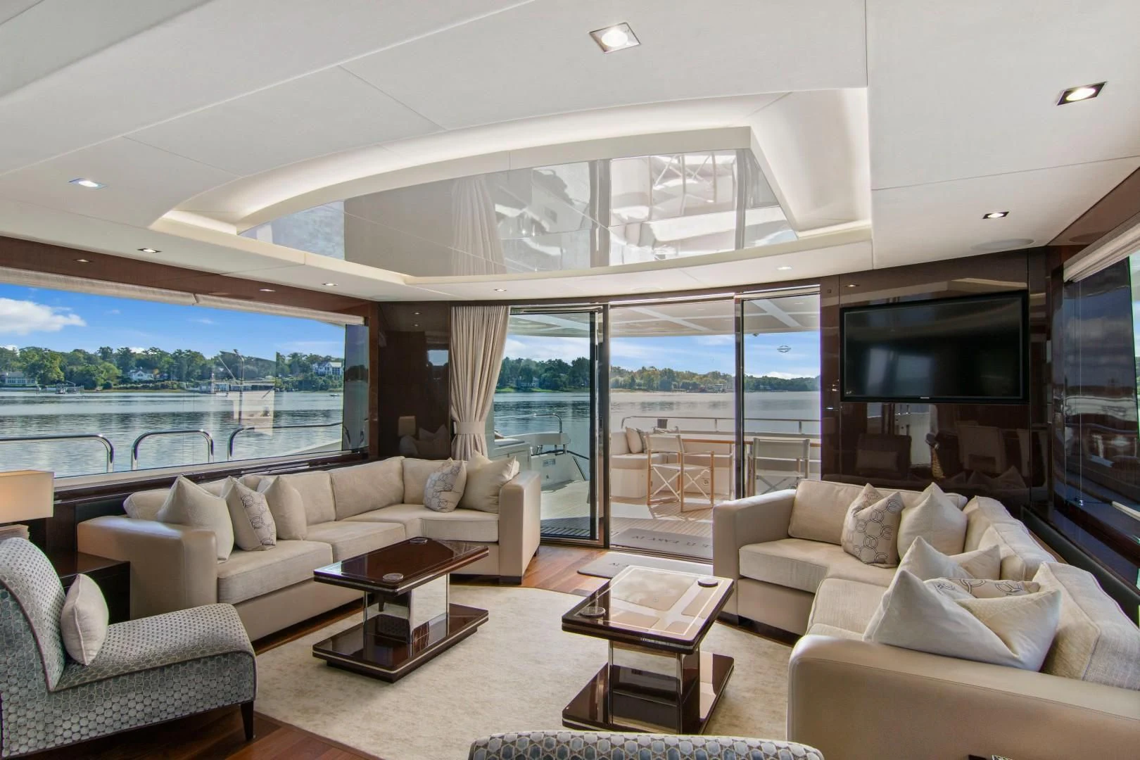 a living room with a large window aboard GOLDEN OURS Yacht for Sale