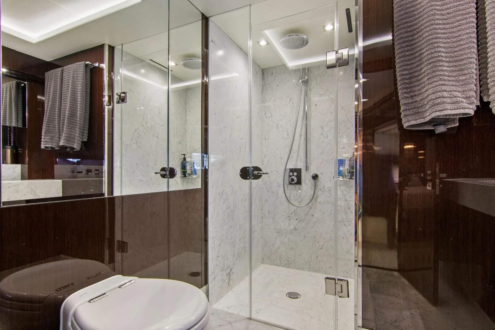 a bathroom with a glass shower aboard GOLDEN OURS Yacht for Sale