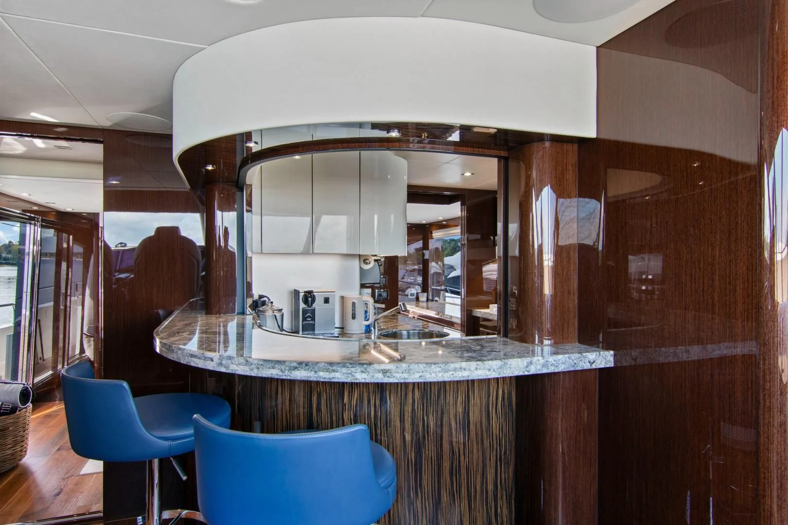 a kitchen with a large mirror aboard GOLDEN OURS Yacht for Sale