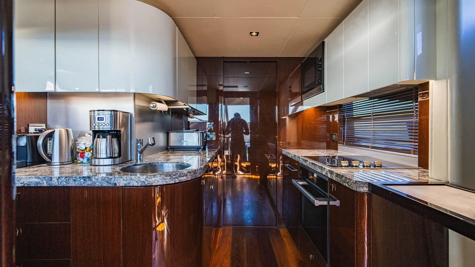 a kitchen with a wood floor aboard GOLDEN OURS Yacht for Sale