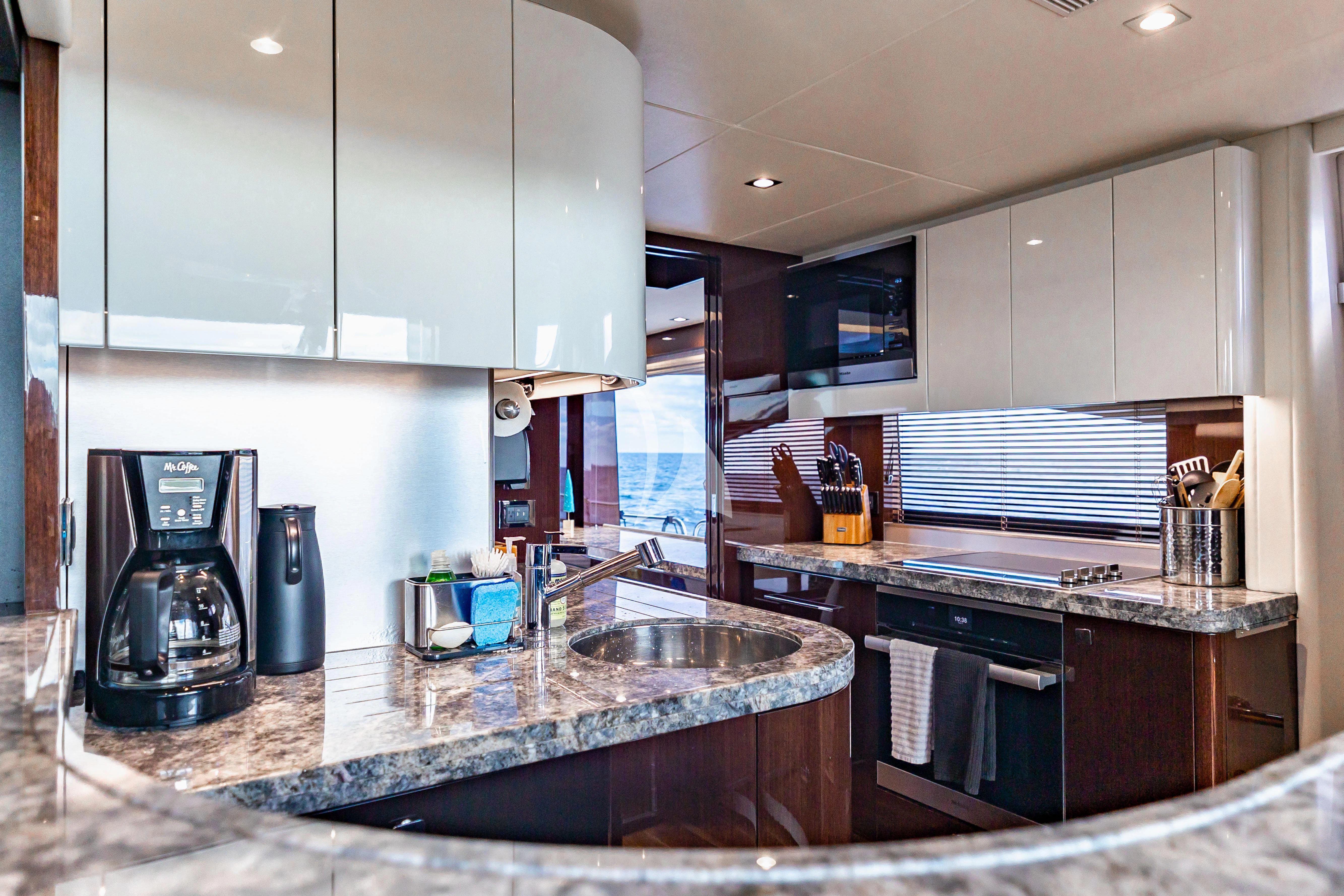 a kitchen with a sink and cabinets aboard GOLDEN OURS Yacht for Sale