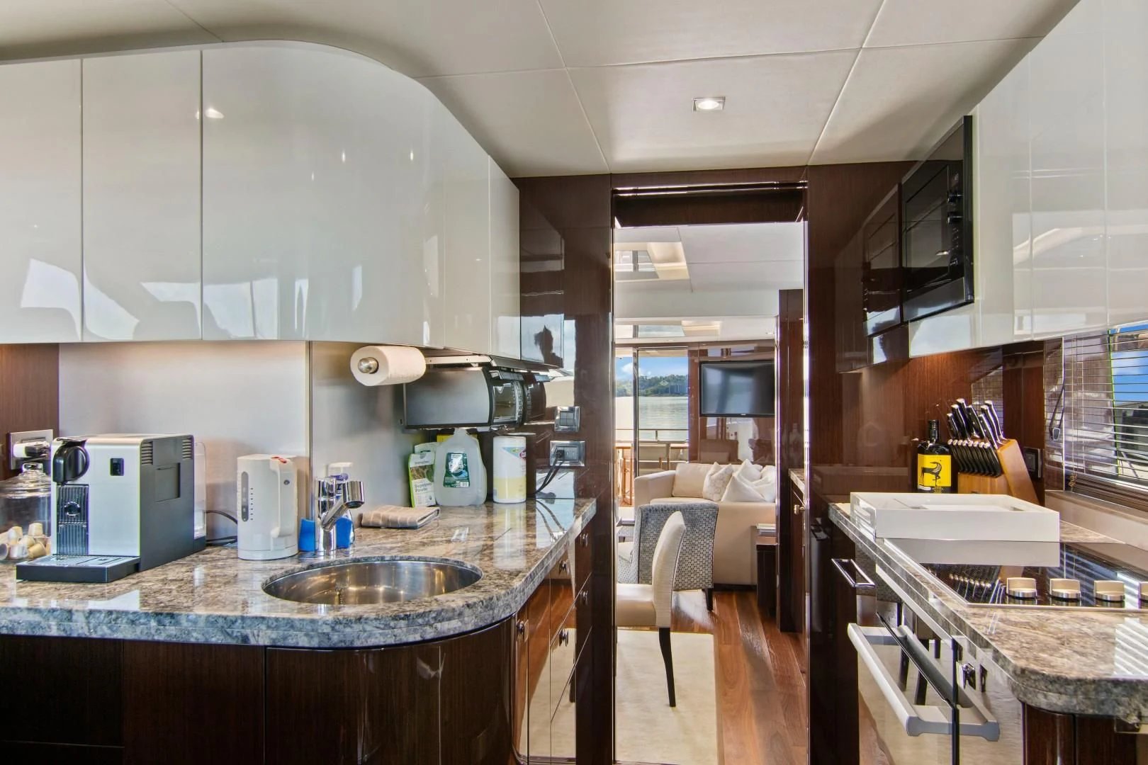a kitchen with a sink and a microwave aboard GOLDEN OURS Yacht for Sale