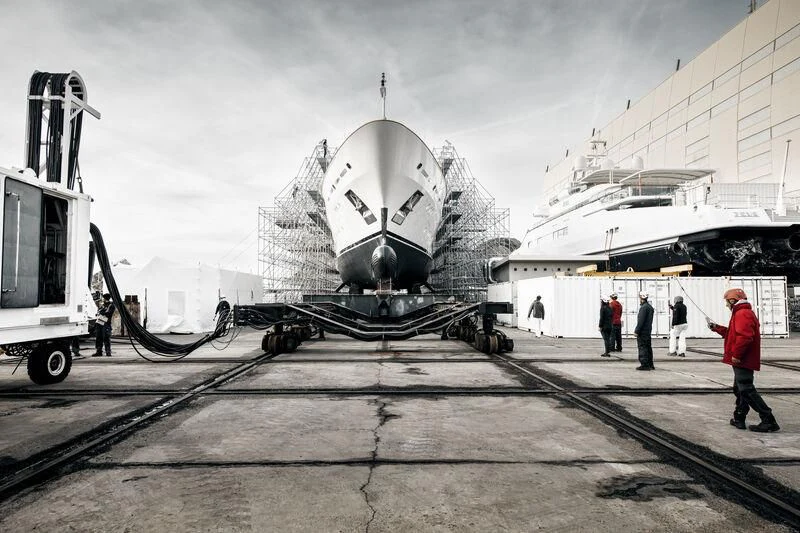 a large ship docked at a pier aboard GALAXY Yacht for Sale