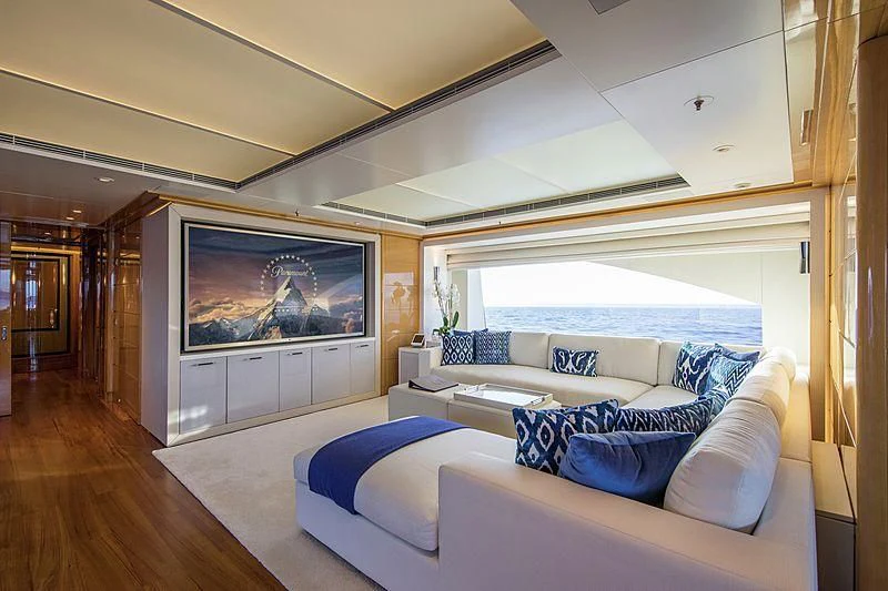 a living room with a large screen aboard GALAXY Yacht for Sale