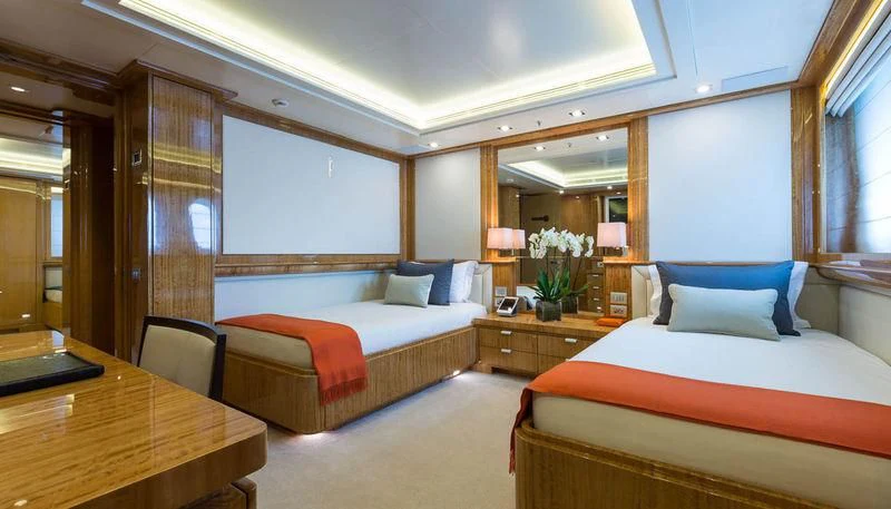 a room with a bed and a desk aboard GALAXY Yacht for Sale