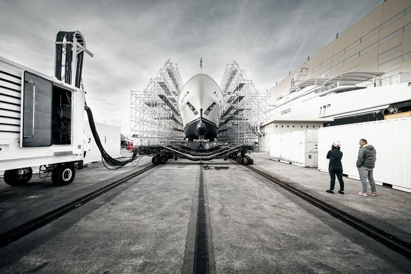 a couple of people standing next to a large machine aboard GALAXY Yacht for Sale