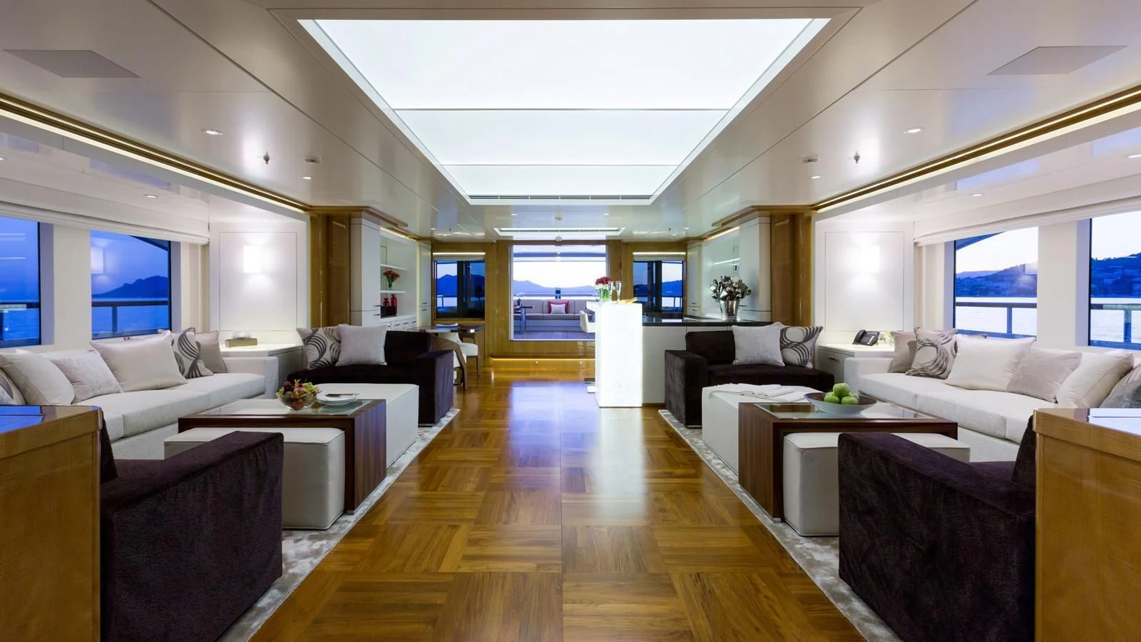 a living room with a wood floor aboard GALAXY Yacht for Sale