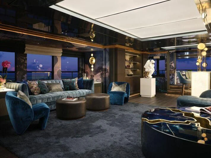 a living room with a large mirror aboard GALAXY Yacht for Sale