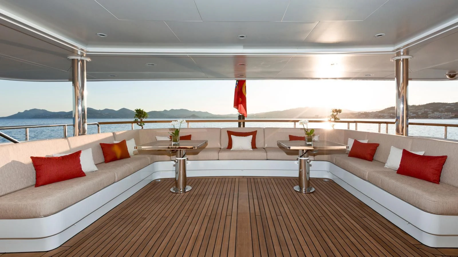 a room with a couch and a table with a table and chairs aboard GALAXY Yacht for Sale
