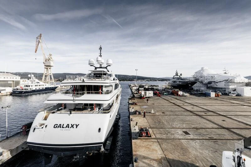 a boat docked at a pier aboard GALAXY Yacht for Sale
