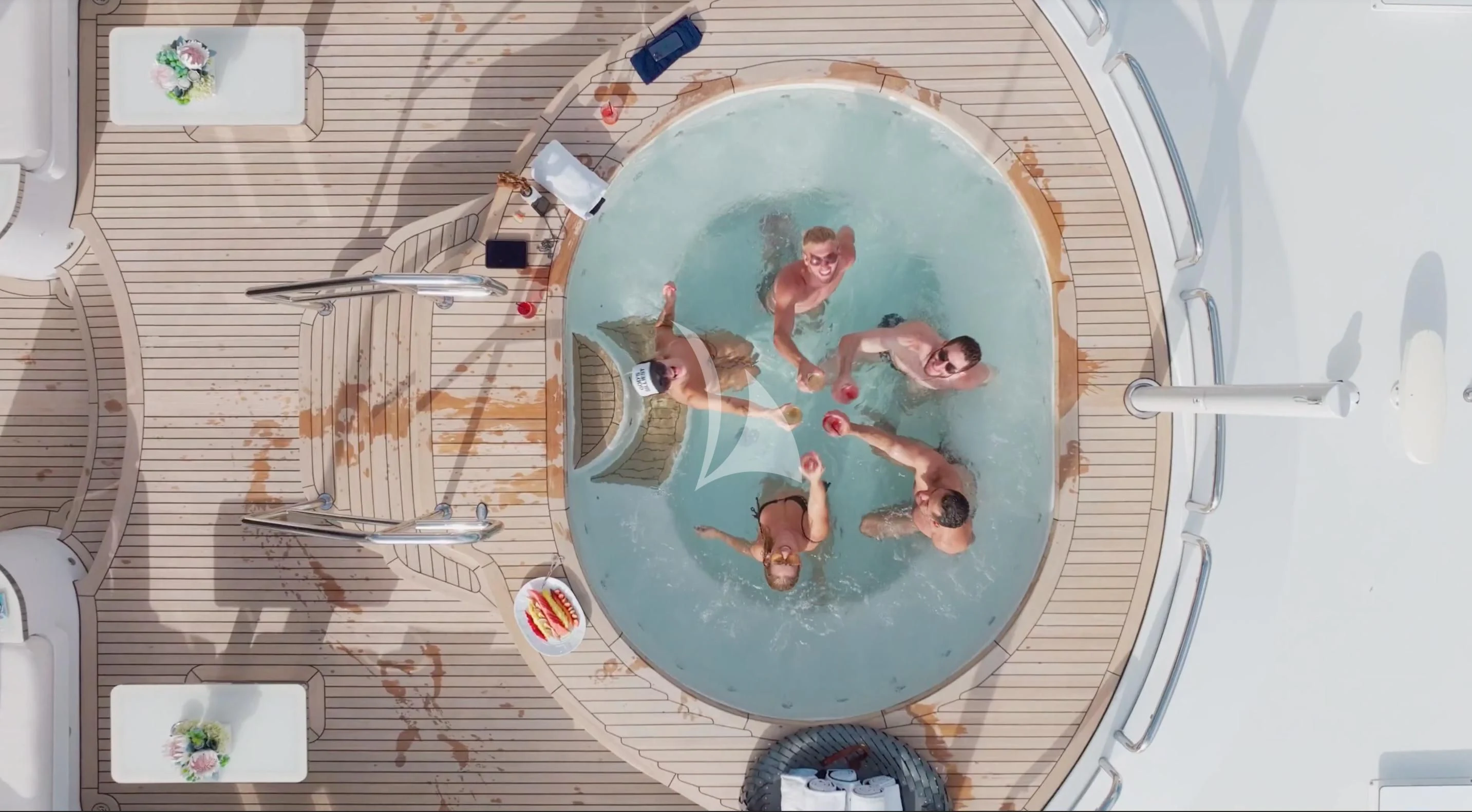 a group of people in a round pool aboard GALAXY Yacht for Sale