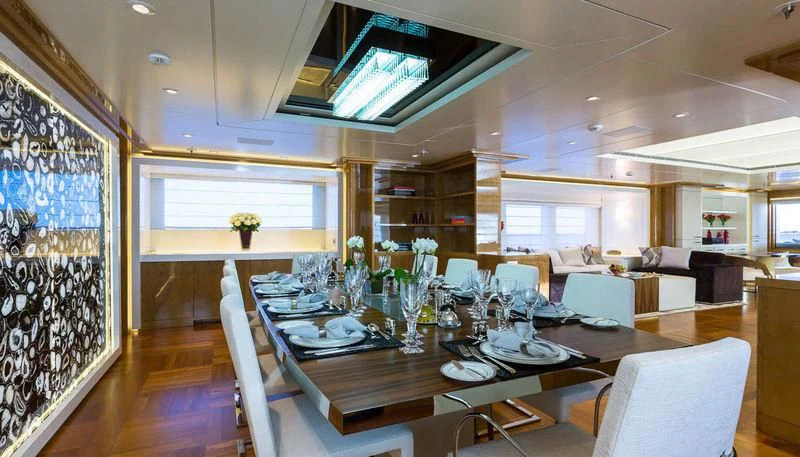 a dining room with a table and chairs aboard GALAXY Yacht for Sale