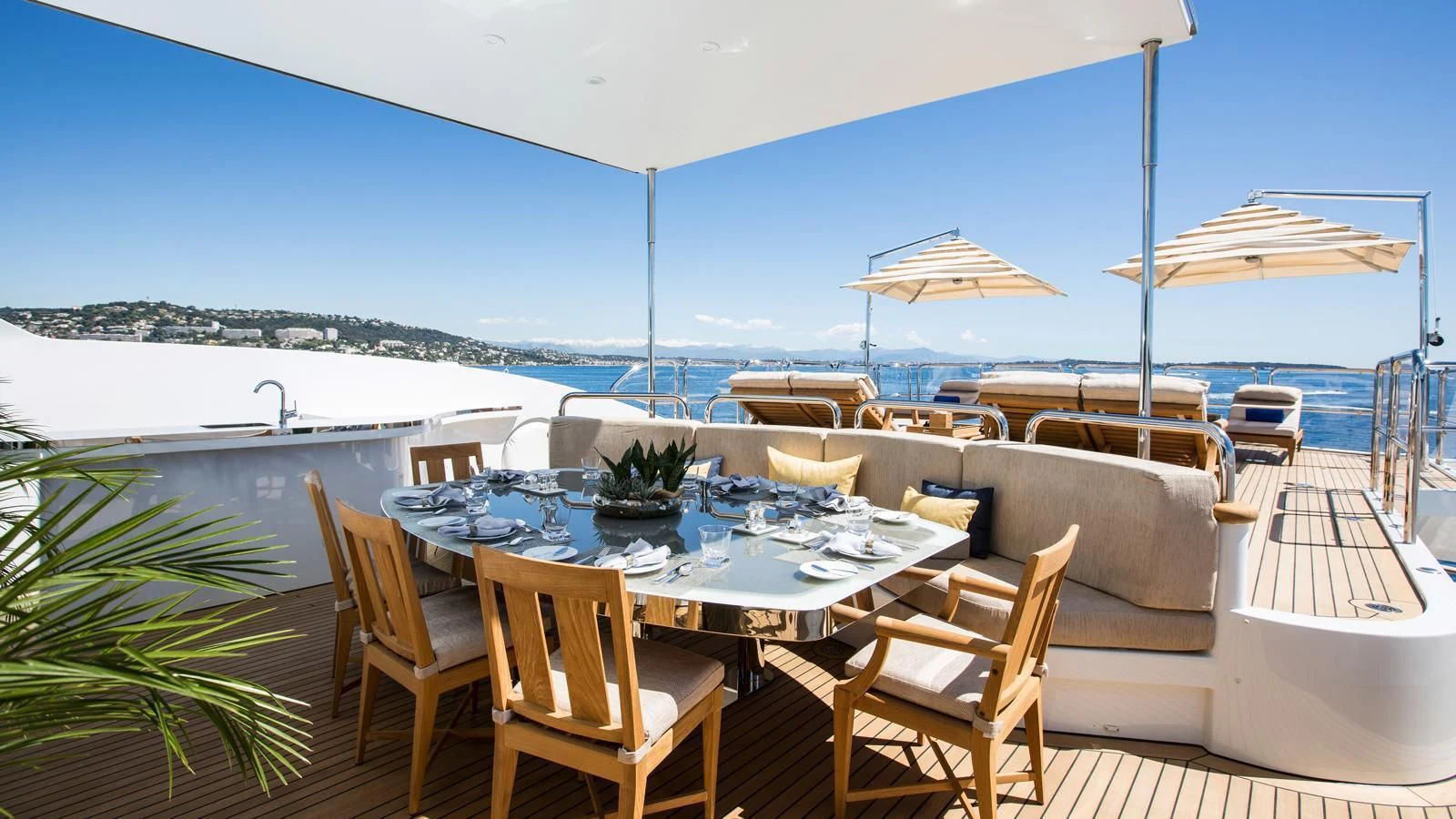 a table and chairs on a patio aboard GALAXY Yacht for Sale