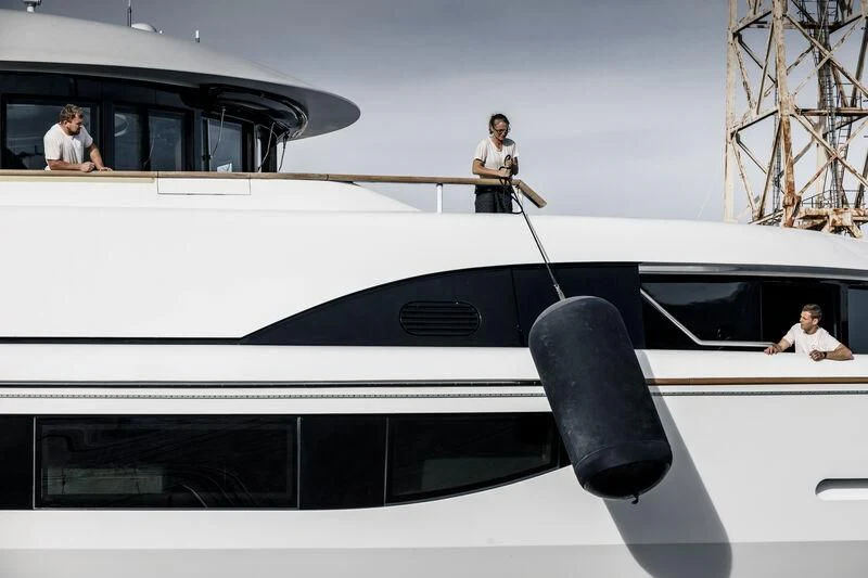 a couple of men sitting on a yacht aboard GALAXY Yacht for Sale