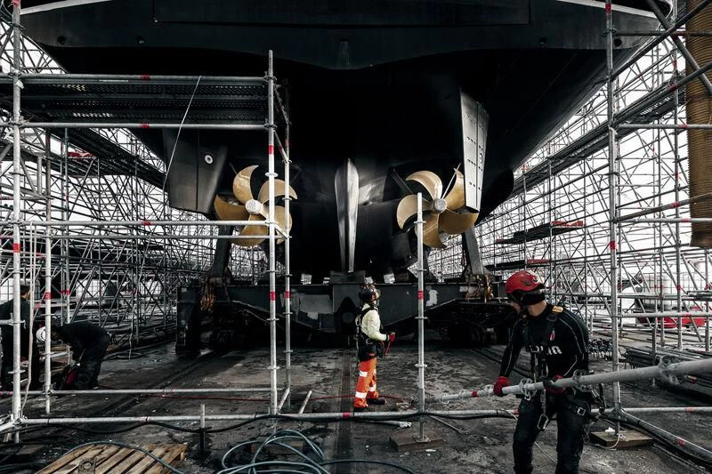 a group of men working on a large machine aboard GALAXY Yacht for Sale