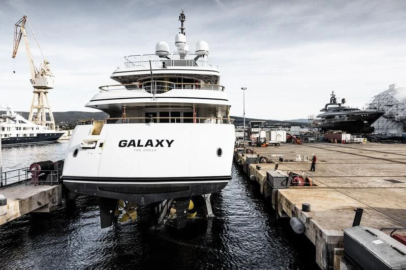 a large white ship docked aboard GALAXY Yacht for Sale