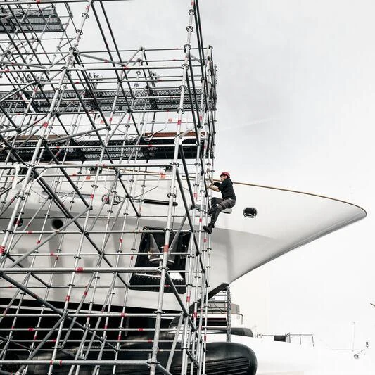 a person standing on the top of a large ship aboard GALAXY Yacht for Sale