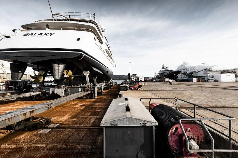 a large white ship docked aboard GALAXY Yacht for Sale