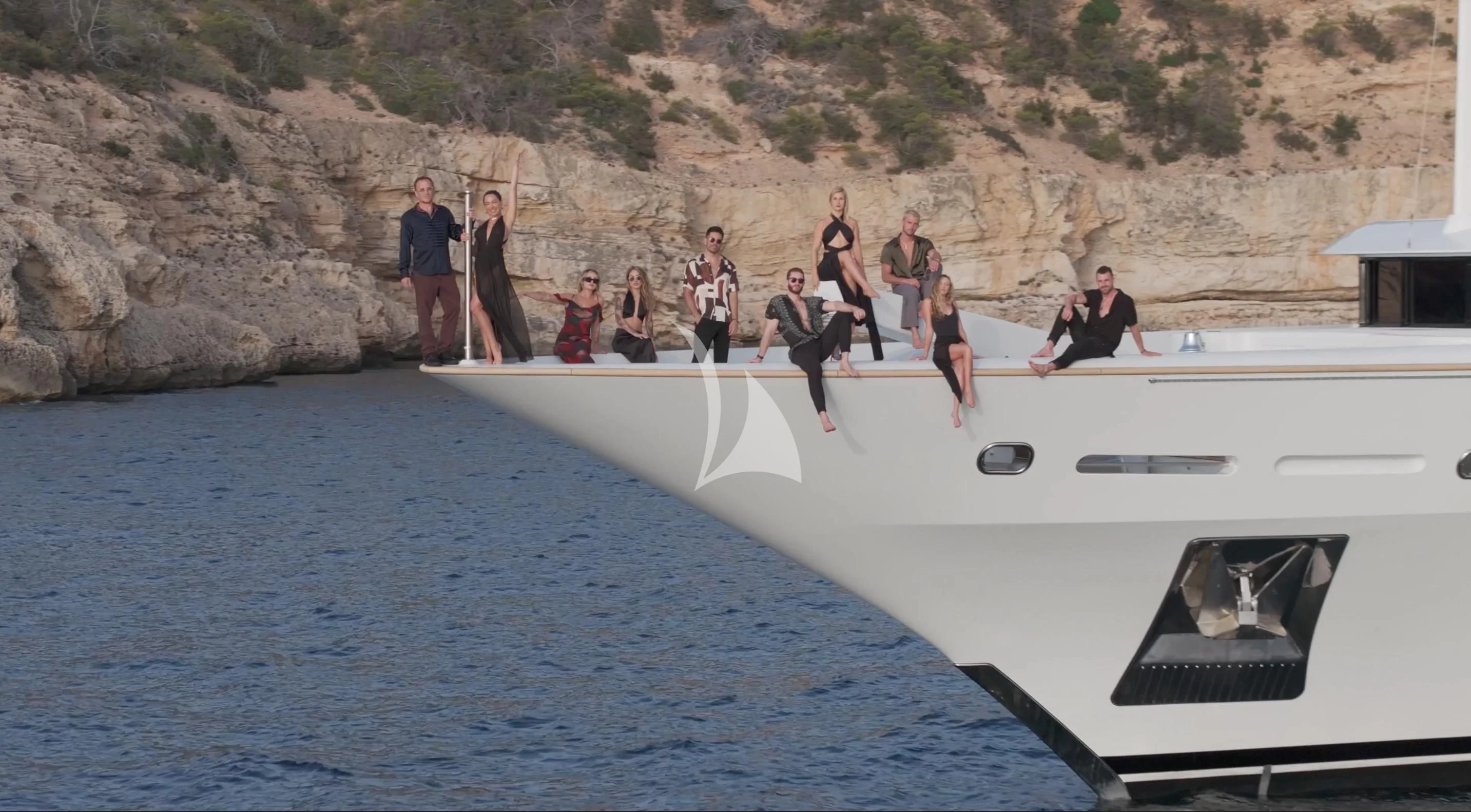 a group of people standing on a boat in the water aboard GALAXY Yacht for Sale
