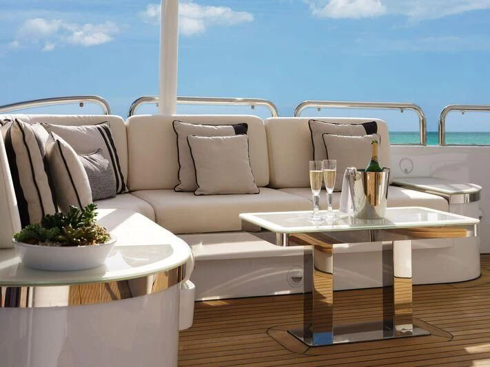 a table with a plant on it aboard GALAXY Yacht for Sale
