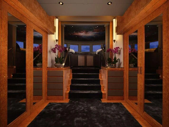 a room with a wood door and a large window aboard GALAXY Yacht for Sale