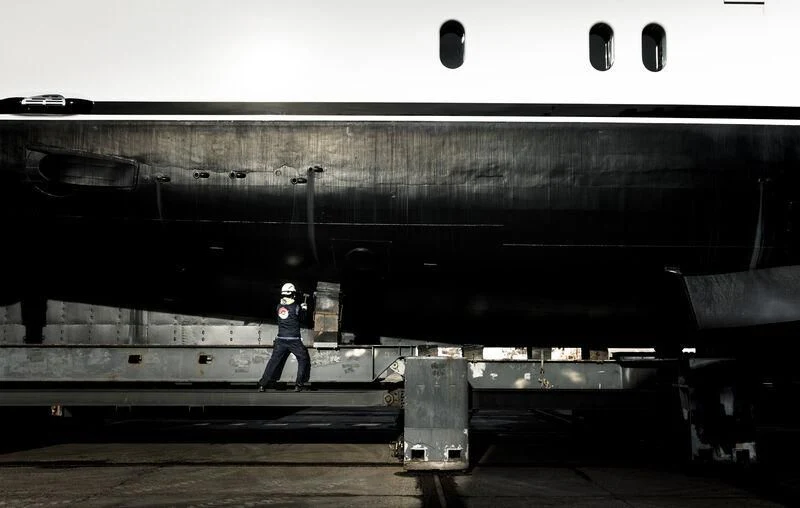 a person standing next to a large ship aboard GALAXY Yacht for Sale
